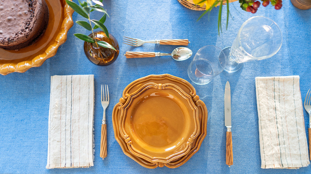 Table setting with ochre plates
