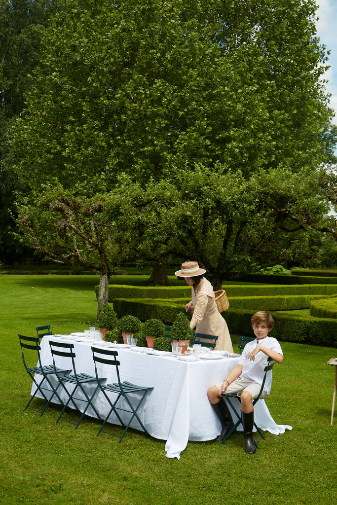 Zoë de Givenchy setting a table in the garden 