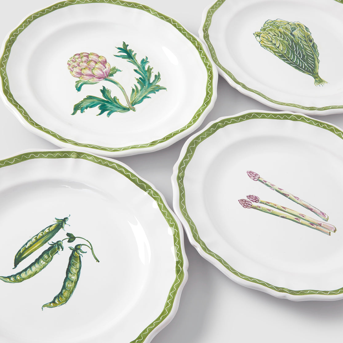 A top-down product photograph of vegetable plates