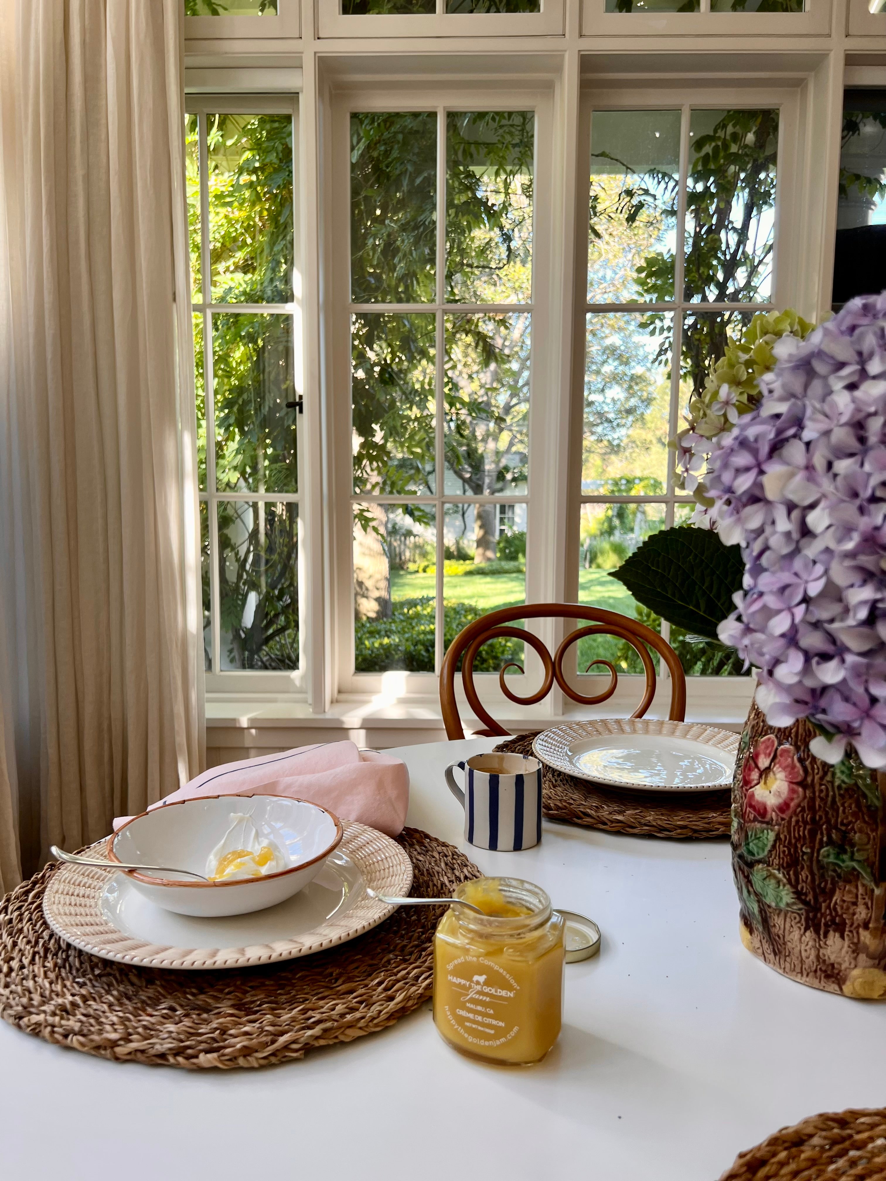 Table Setting with Pink Linen Napkin, Blue Edge