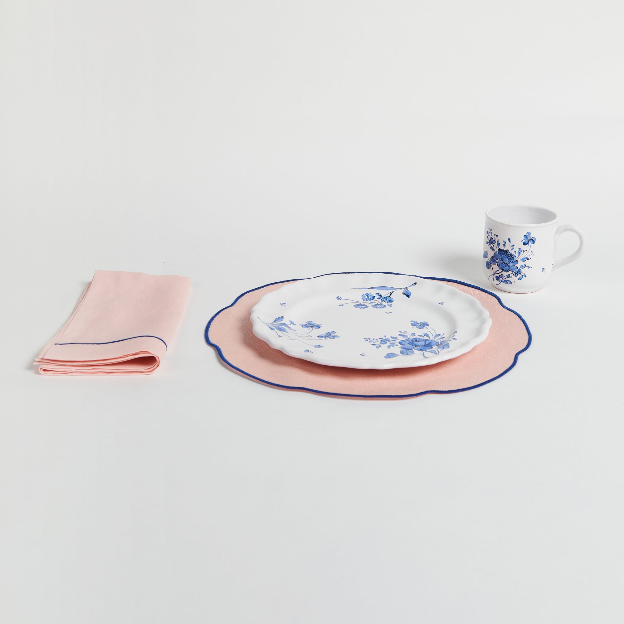 table setting with Coated Pink Linen Placemat, Blue