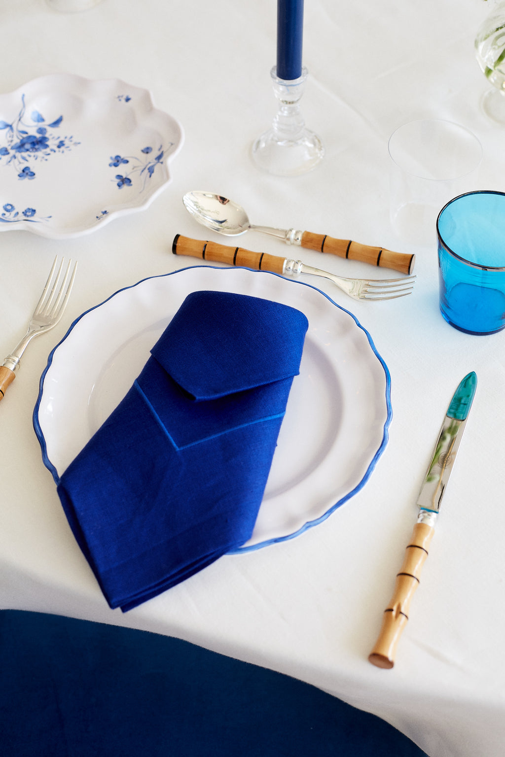 table setting with Large High Hem Cord Embroidered Dinner Napkin, Royal Blue