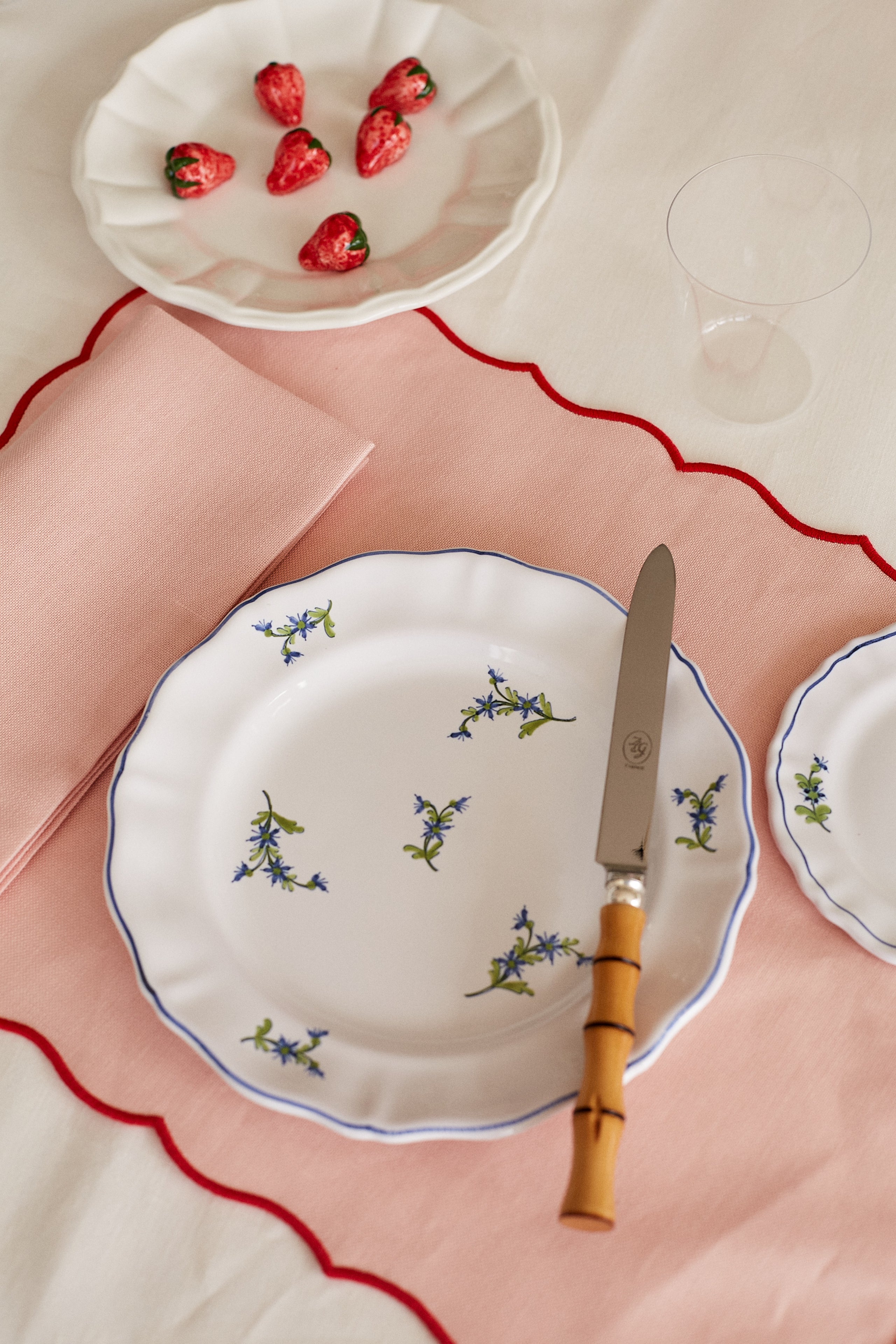Table Setting with Scallop Edged Coated Placemat, Framboise